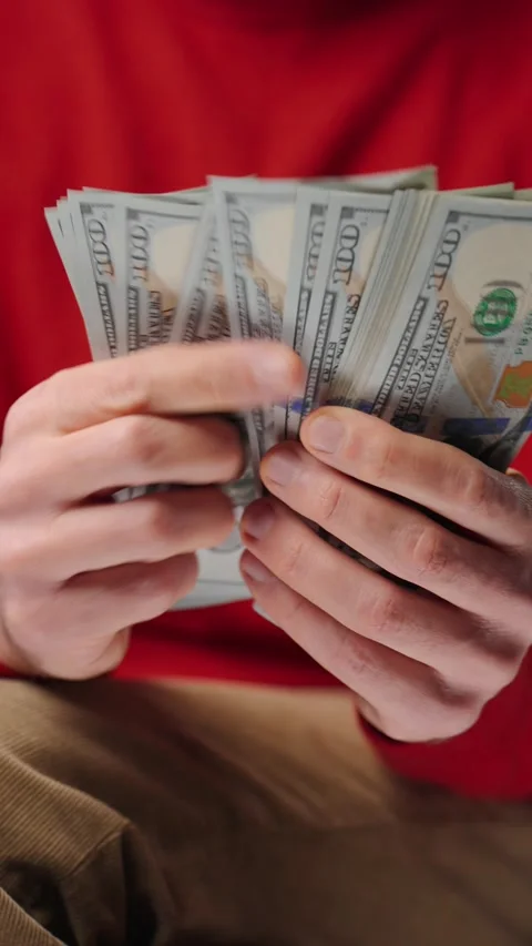 Man counting US Dollar bills, close-up Stock Footage 312015291