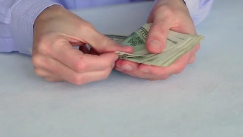Man Counting US Dollar Bills at Office Desk Stock Footage 320128704