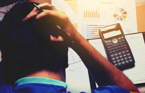 Man counting using calculator and stress in problem about cost. Stock Photos