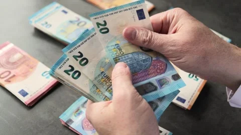 A man counts banknotes in his hands. Concepts for family budgeting, saving money Stock Footage 330419334