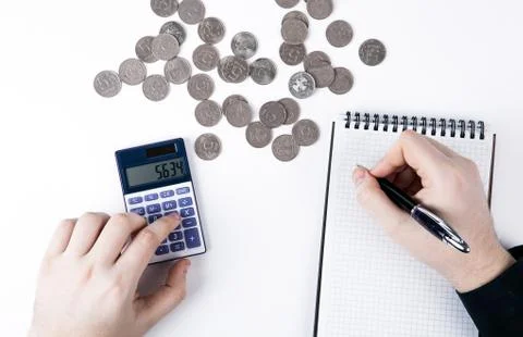 Man counts budget on a white Stock Photos