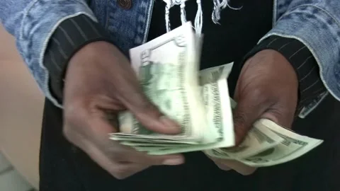 A man counts dollar bills for his investments. Closeup of hands counting dollar Stock Footage 336261150