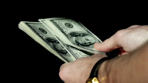 A man counts dollars. Budget, loan payment, investment planning, calculating Video stock 336262645