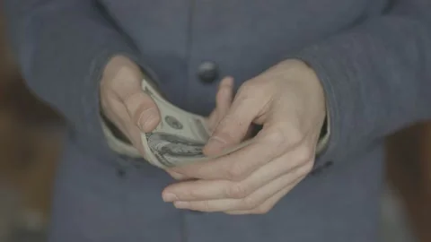 Man counts dollars in his hands. close-up shot. Stock Footage 133123092