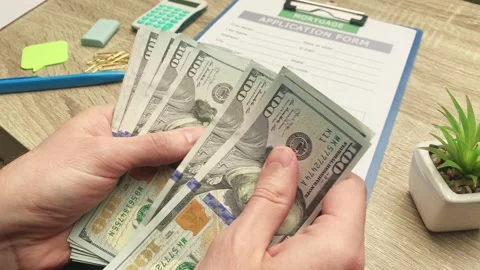 Man counts euros of banknotes received for the payment of a mortgage loan. Stock Footage 163318862