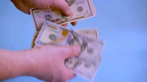Man counts hundred-dollar bills. Close-up of men's hands counting money in cash Stock Footage 149003244