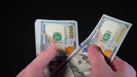 Man counts hundred-dollar bills. Counting money close-up 4k video. Paper money Stock Photos
