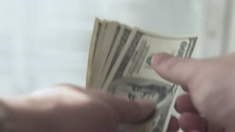  Man counts money in the hands of dollars close-up Stock Footage 135808070
