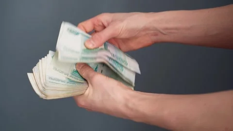 Man counts paper, 1000 rubles bills. Russian cash money in male hand. Stock Footage 330589296