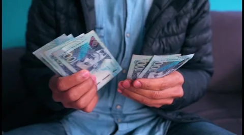 Man counts Peruvian 100 soles bills. Stock Footage 283423243