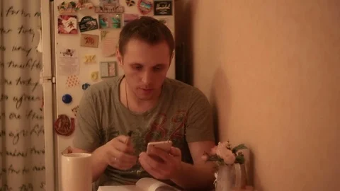 A man counts on the phone and writes the result to a notebook Stock Footage 82185826