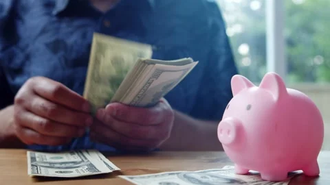 Man Counts Stack Of 100 Dollar Bills In Kitchen In Daylight Close Up Scene Video stock 312526511