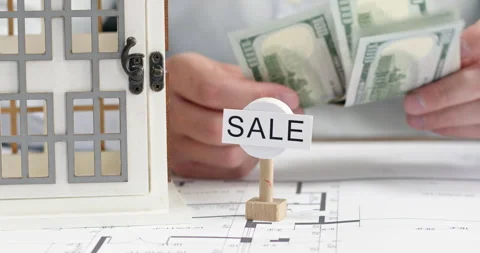 Man counts stack of dollar bills intended for buying new house Video stock 314731386