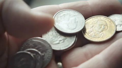 Man counts US coins in hand, slow motion Stock Footage 55768812