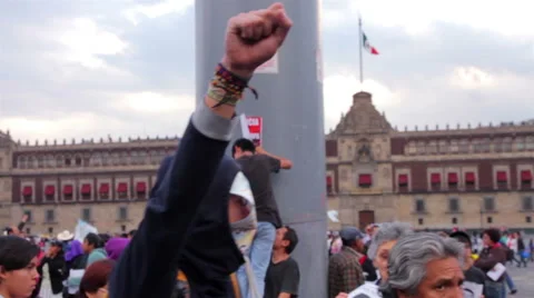 Man cover his face with a drawing of one student disappeared in Ayotzinapa. Stock Footage 44272456