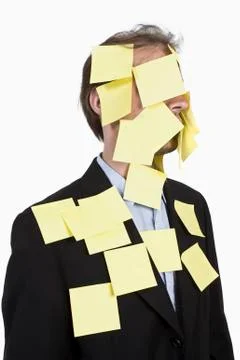 A man covered in blank adhesive notes Stock Photos