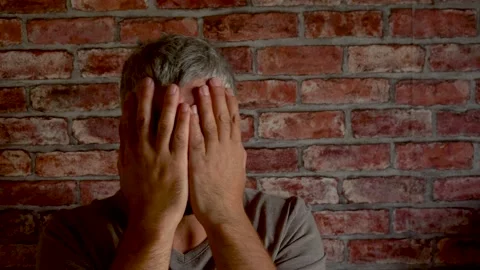 The man covered his face with his hands 4K Stock Footage 160118952
