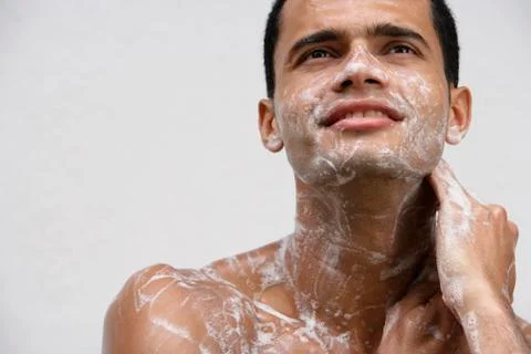 Man covered in soap suds Stock Photos