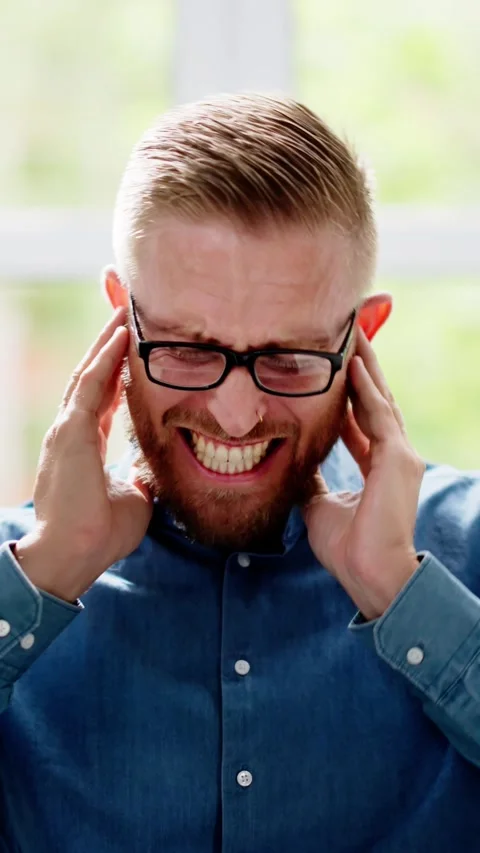 Man Covering Ear With Hands Stock Footage 274765299