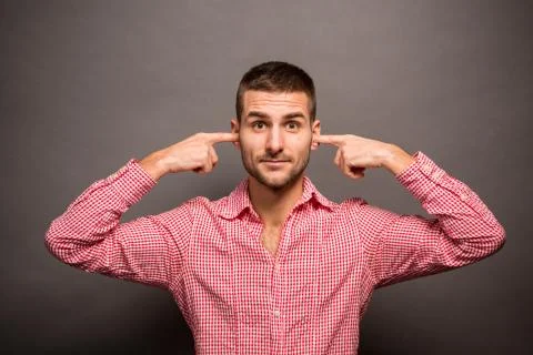 Man covering his ears Stock Photos