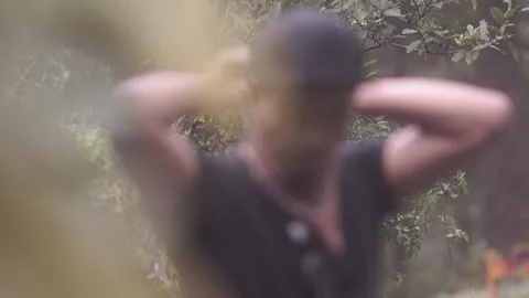 Man covering his face Stock Footage 243095768