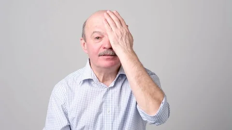 Man covering one eye during vision examination trying to see letters. Stock Footage 102803551
