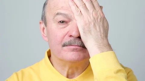 Man covering one eye during vision examination trying to see letters. Stock Footage 102806674