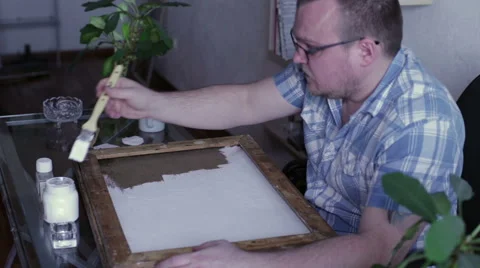 Man covers the canvas ground Stock Footage 59788640