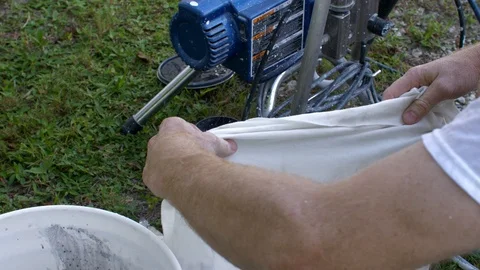 Man Covers Paint Can to Protect from Drying Out Stock Footage 95483049