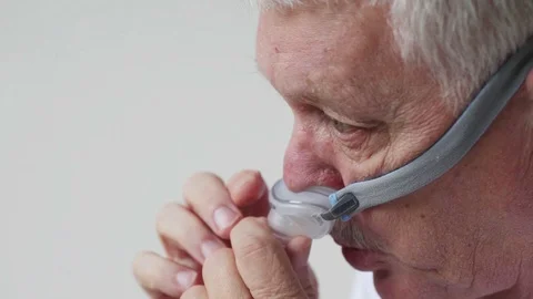 Man with CPAP device headgear closeup Stock Footage 90672370