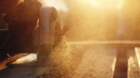 Man is craft working at a work bench with power tools in slowmotion during Видео 66552837