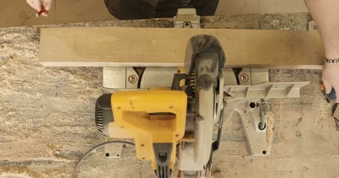 Man is craft working at a work bench with power tools Stock Footage 74722908