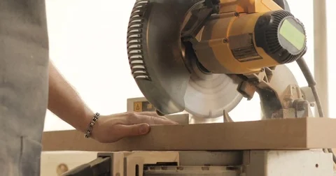 Man is craft working at a work bench with power tools Stock Footage 74723302
