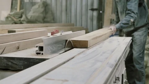 Man is craft working at a work bench with power tools in slowmotion Stock Footage 85123311