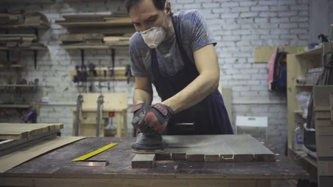 Man is craft working at a work bench with power tools Stock Footage 102785036