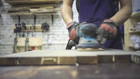 Man is craft working at a work bench with power tools Stock Footage 102785046