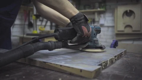 Man is craft working at a work bench with power tools Stock Footage 102785141