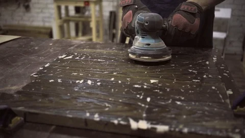Man is craft working at a work bench with power tools Stock Footage 102785253