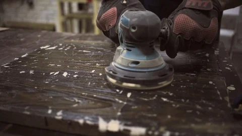 Man is craft working at a work bench with power tools Stock Footage 102785274