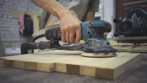 Man is craft working at a work bench with power tools Vídeos de archivo 102857807