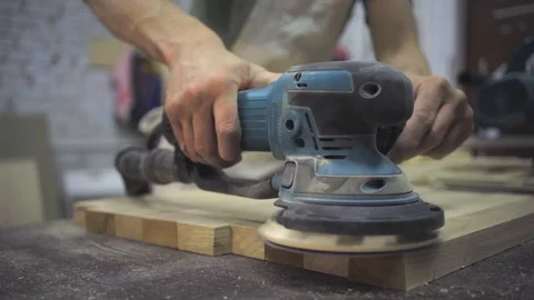 Man is craft working at a work bench with power tools Stock Footage 102857808
