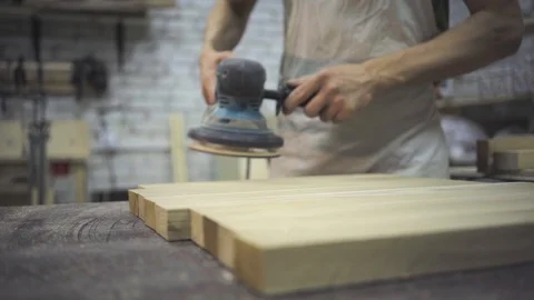 Man is craft working at a work bench with power tools Stock Footage 102857822