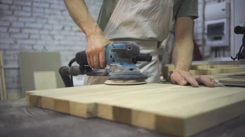Man is craft working at a work bench with power tools Stock Footage 102857827