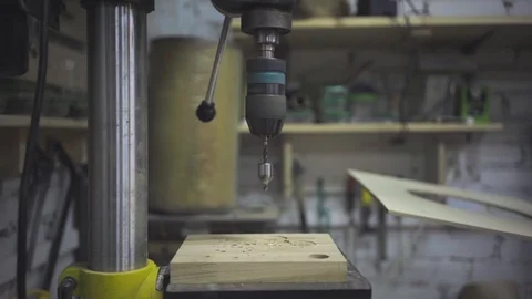 Man is craft working at a work bench with power tools Stock Footage 102857887