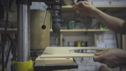 Man is craft working at a work bench with power tools Stock Footage 102857933