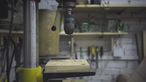 Man is craft working at a work bench with power tools Stock Footage 102857964