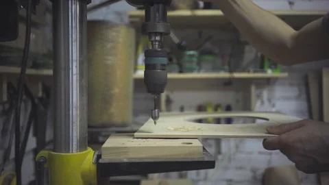 Man is craft working at a work bench with power tools Stock Footage 102857999