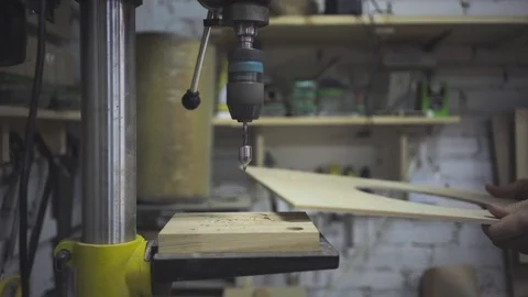 Man is craft working at a work bench with power tools Stock Footage 102858048