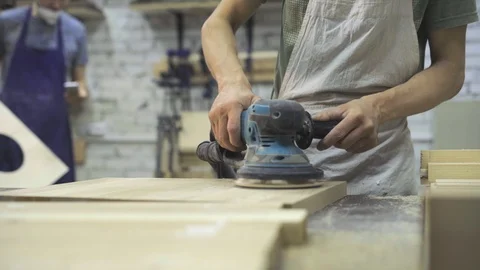 Man is craft working at a work bench with power tools Stock Footage 102858463