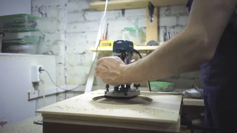 Man is craft working at a work bench with power tools Stock Footage 102902481